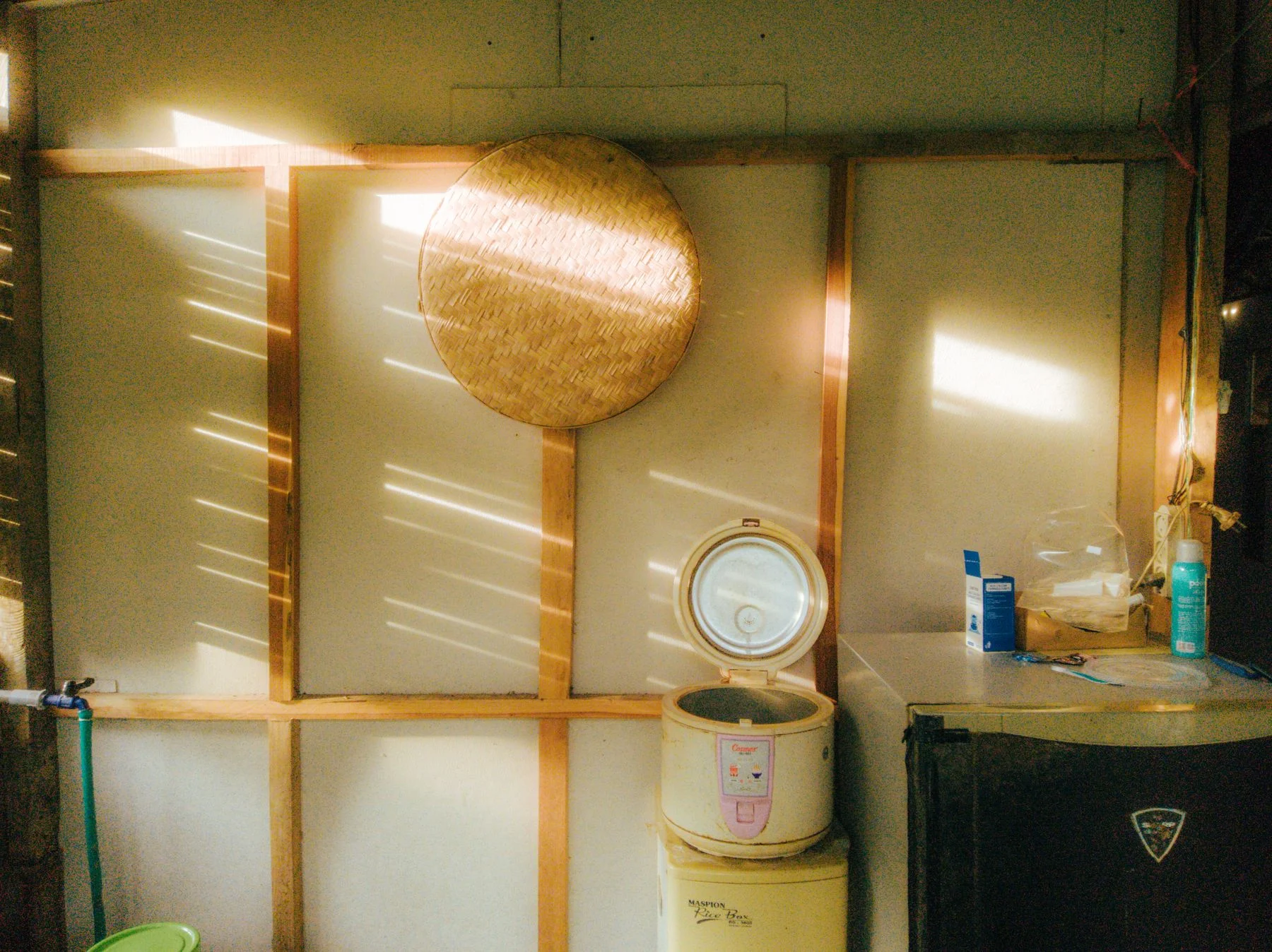 A rice cooker and other kitchen appliances on a counter