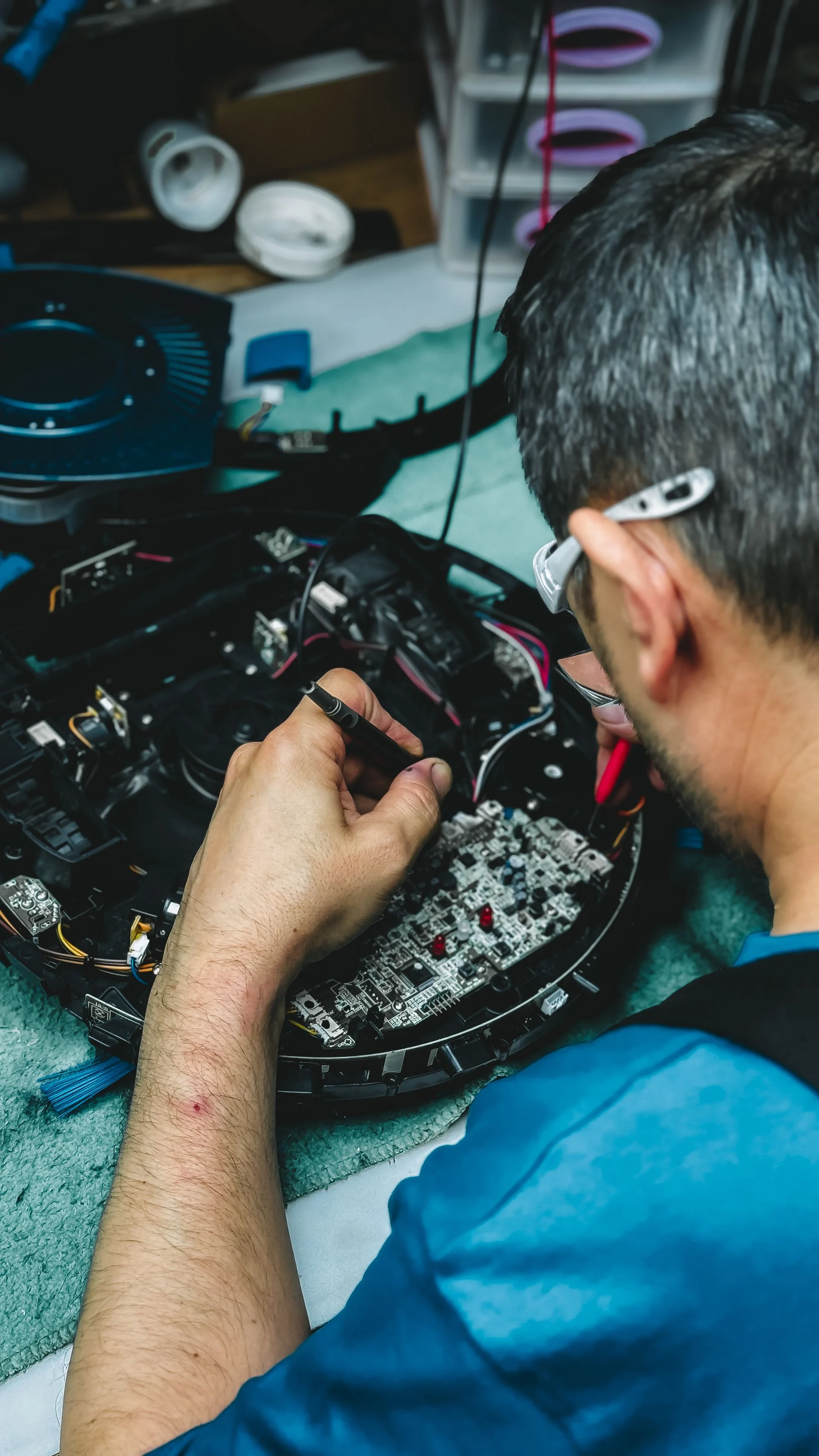 Industry context: a technician working on electronic components